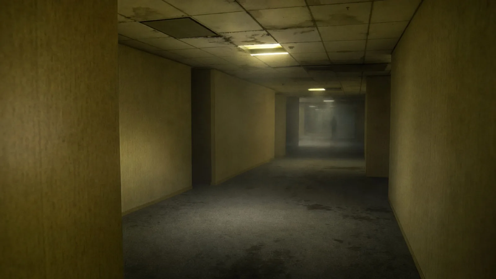 Empty yellow-lit corridor with damp carpet, low fog and a distant silhouette